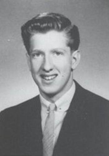 A person in a suit and tie
Description automatically generated